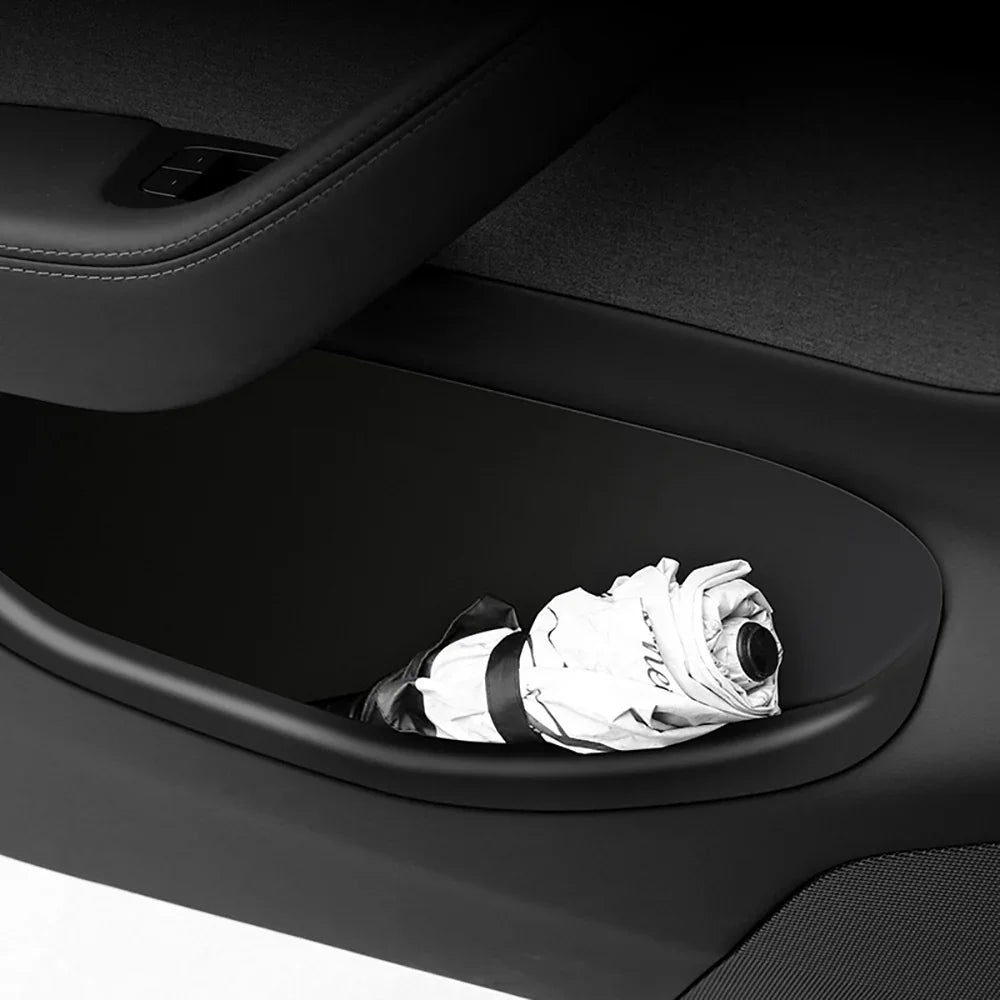 Door storage tray organising everyday essentials in the Model Y door pocket