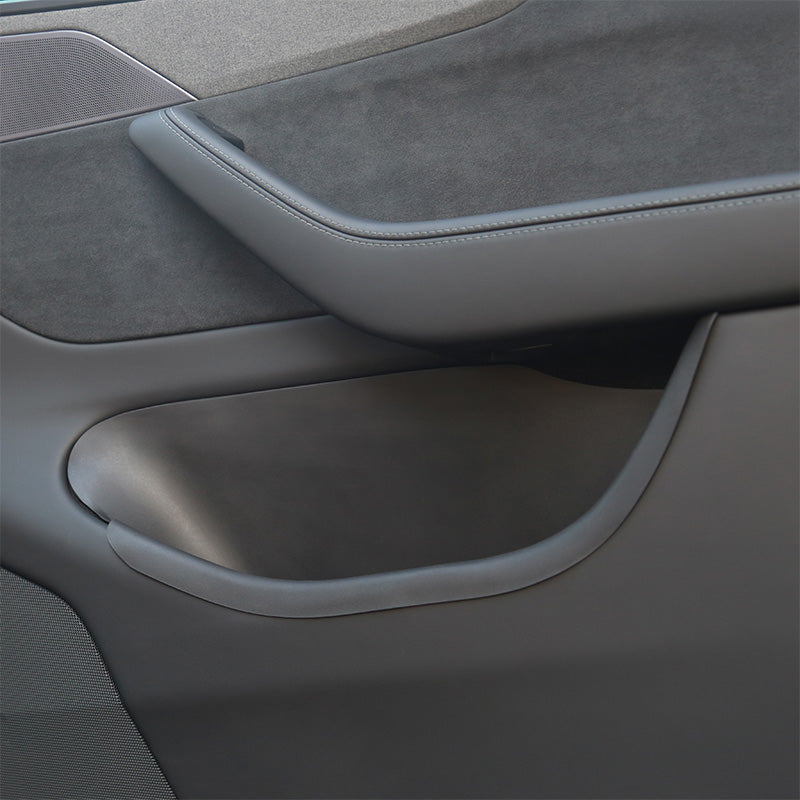 Top view of door storage tray fitted inside the front door compartment of Model Y L