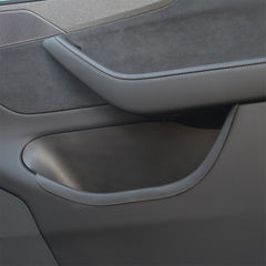 Top view of door storage tray fitted inside the front door compartment of Model Y L