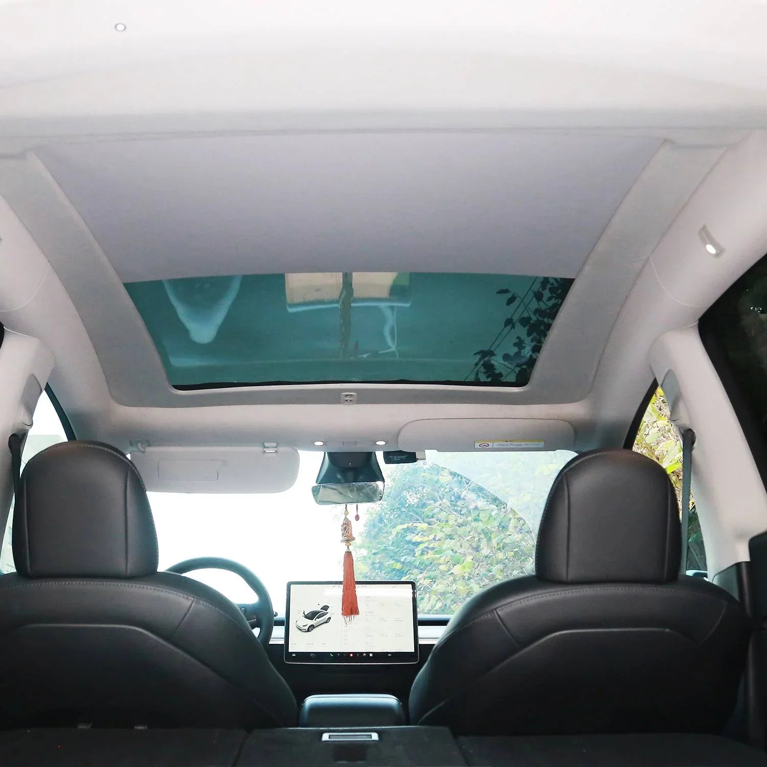 Interior view of Model Y with the electric sunshade sunroof installed