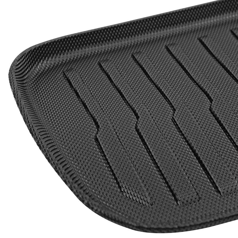 Front boot mat with raised edges for enhanced spill protection in Model Y