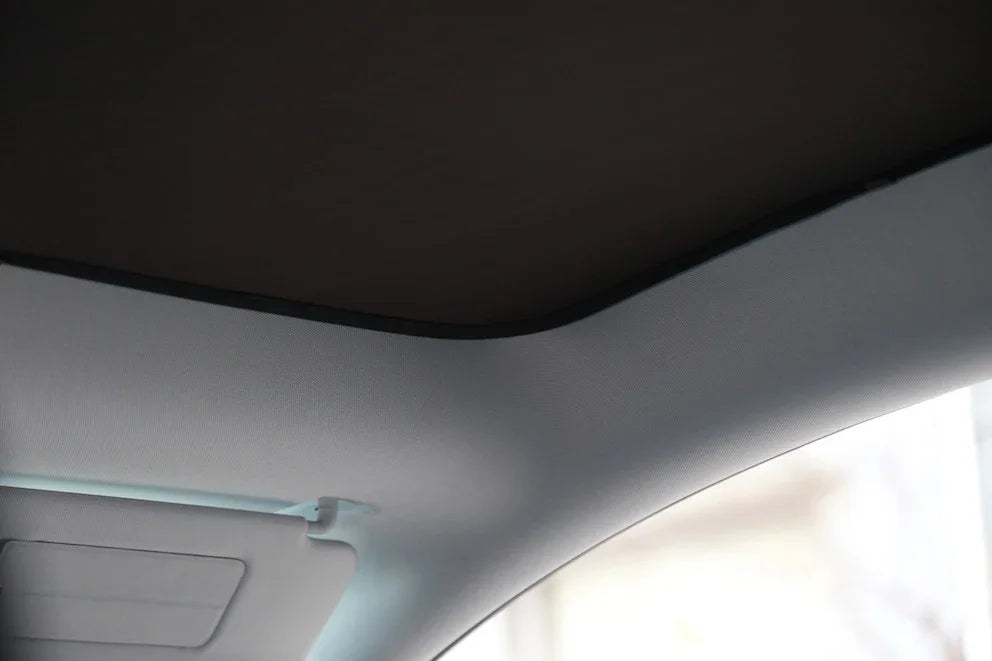 Interior view of the glass roof sunshade installed in Model Y (2025–2026)