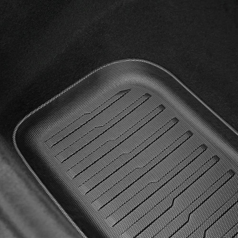 Lower boot mat with raised edges for all-weather protection in Model Y