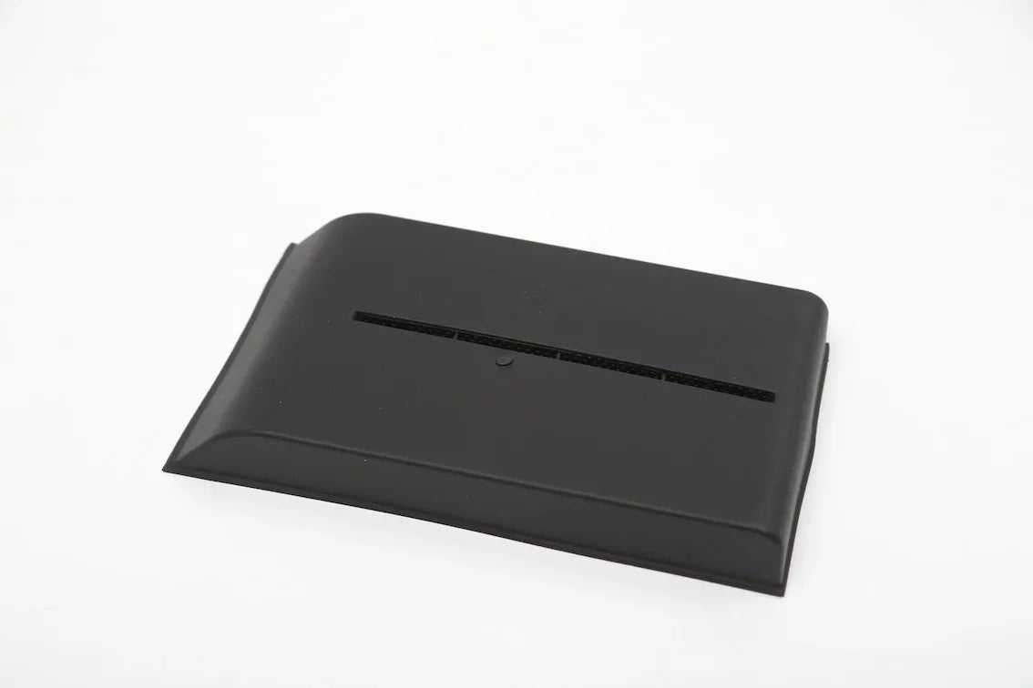 Close-up of the durable TPE lower centre console organiser liner for Model Y