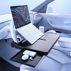 Steering wheel tray table used as a mobile workstation