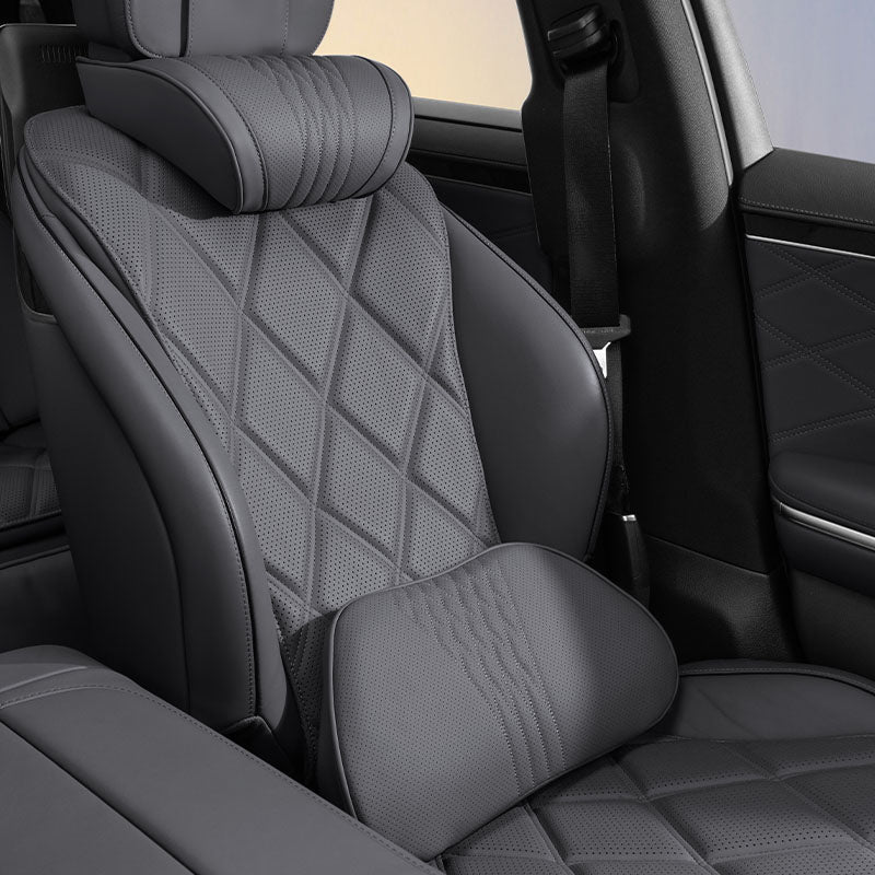 Black Nappa leather neck and lumbar support pillows installed on a vehicle seat