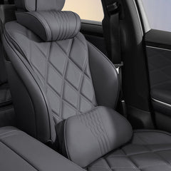 Black Nappa leather neck and lumbar support pillows installed on a vehicle seat