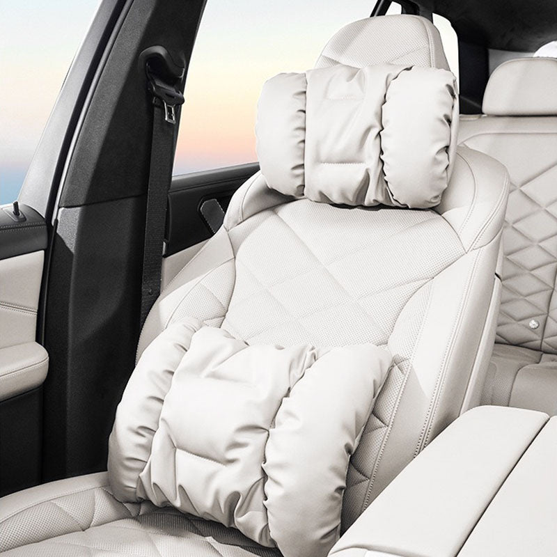 Nappa leather neck and lumbar support pillow installed on a light-coloured seat
