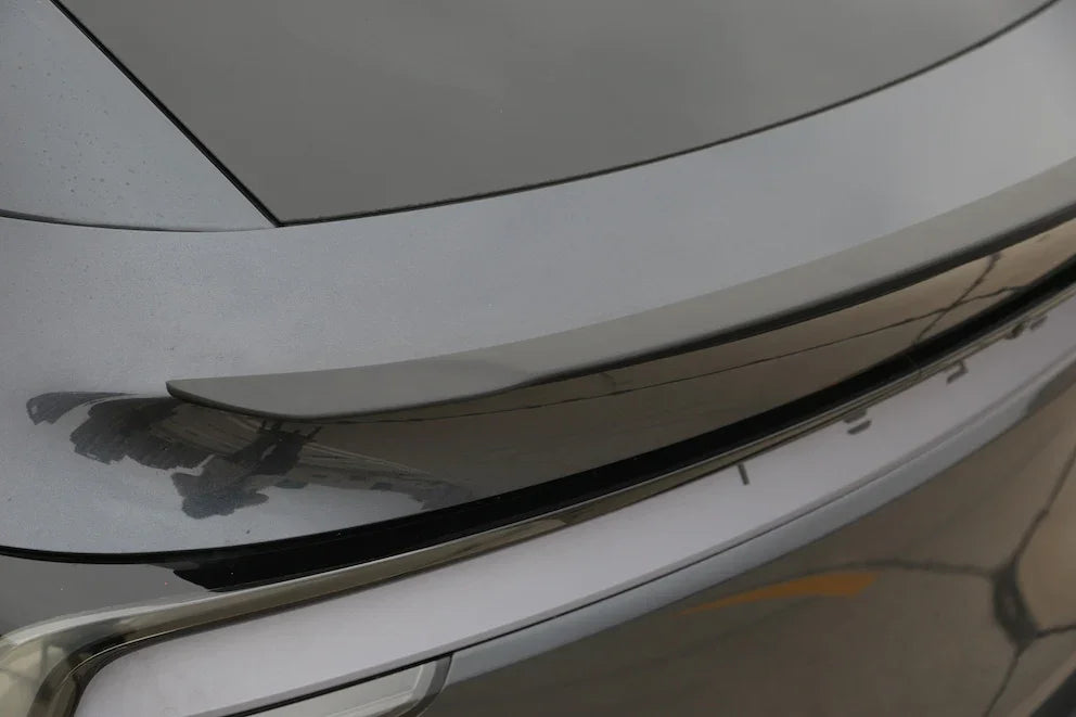 Close-up of the performance spoiler fitted to the rear tailgate of Model Y