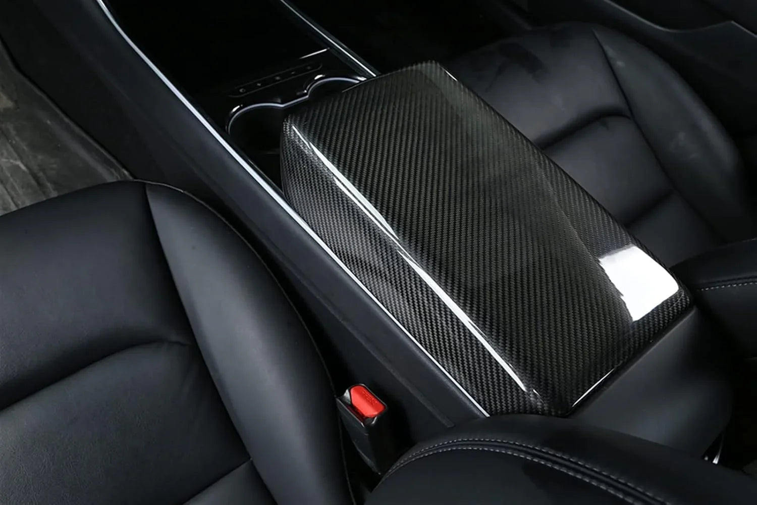 Real carbon fibre armrest cover installed on the centre console