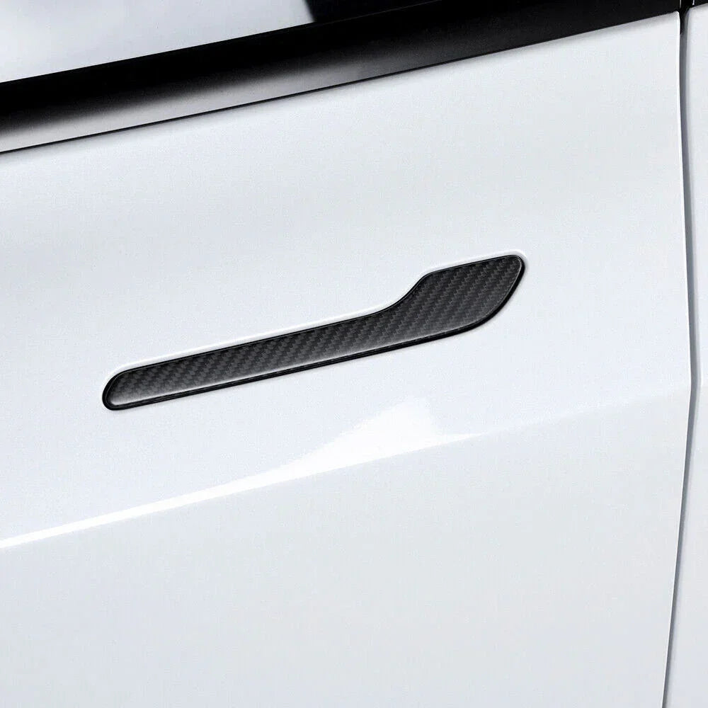 Real carbon fibre door handle wrap cover installed on a white Tesla Model Y or Model 3