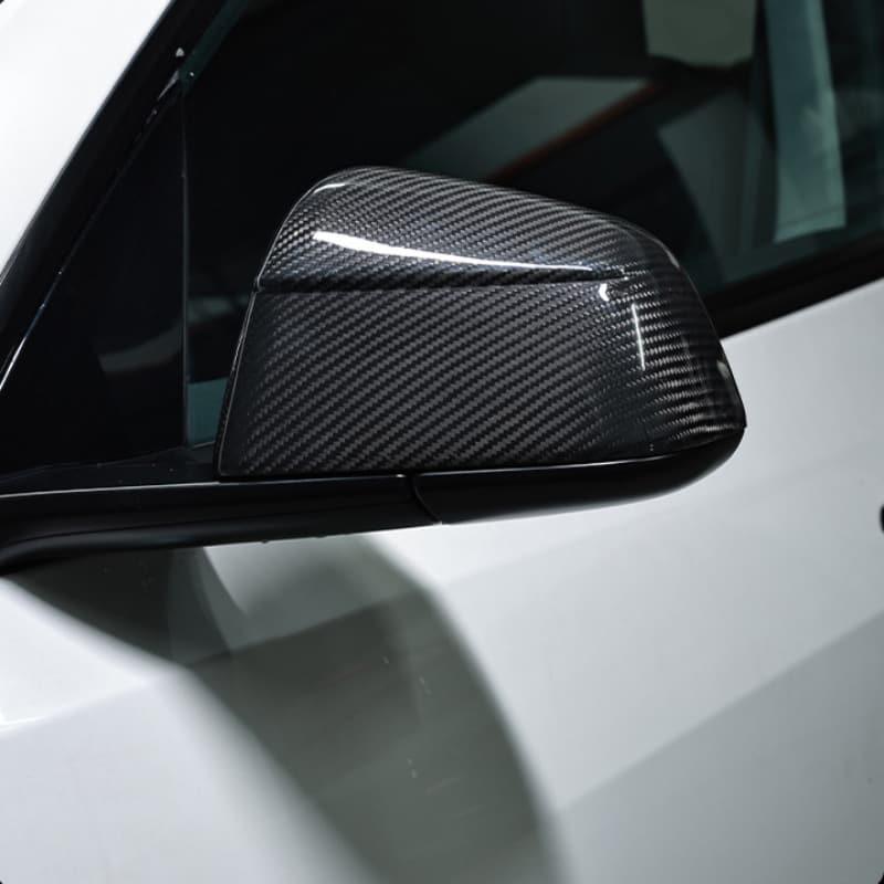 Side view of real carbon fibre rear view mirror covers fitted to Model Y