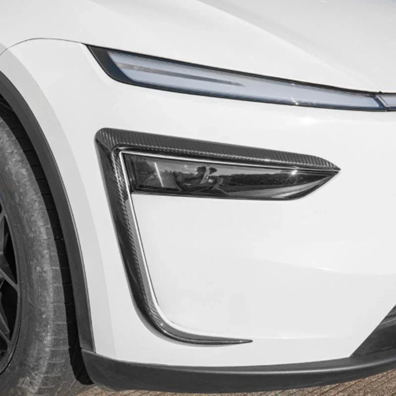 Close-up of the wind deflector headlight trim installed on Model Y