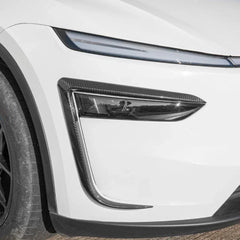 Close-up of the wind deflector headlight trim installed on Model Y