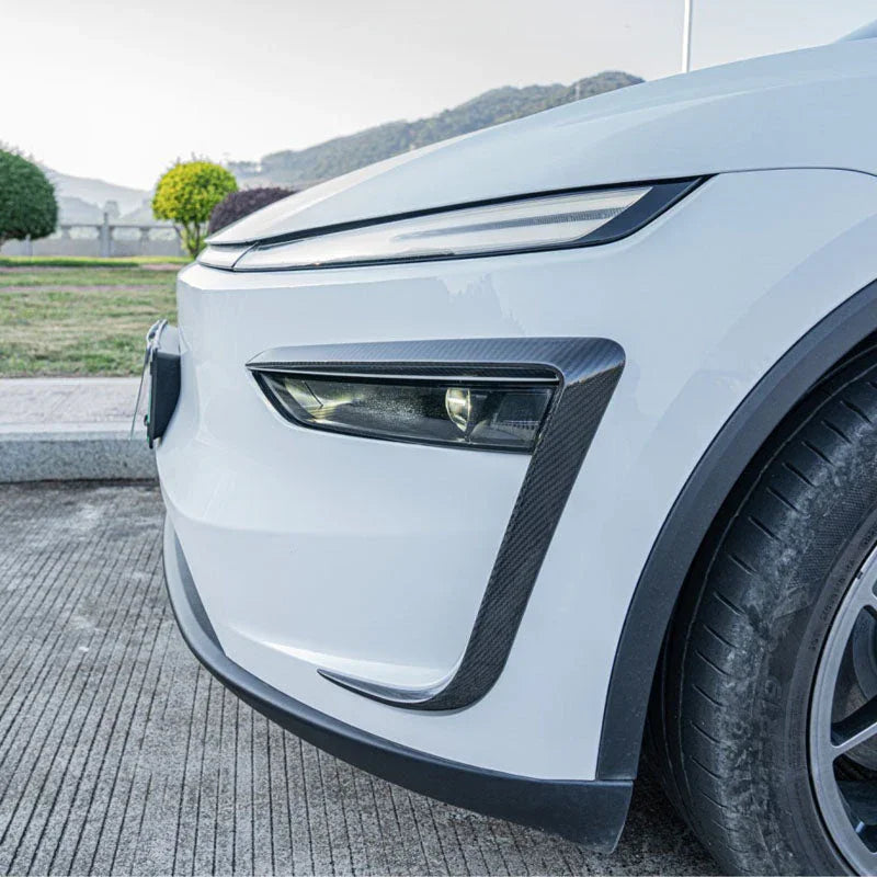 Side view of the wind deflector headlight trim installed on Model Y