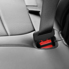 Silicone rear seatbelt buckle cover installed on the left rear seat buckle