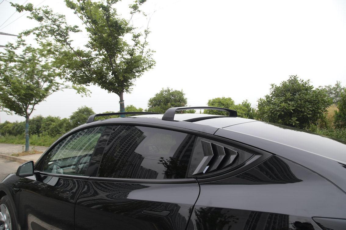 Side view of Model Y fitted with roof rack cross bars