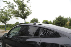 Side view of Model Y fitted with roof rack cross bars