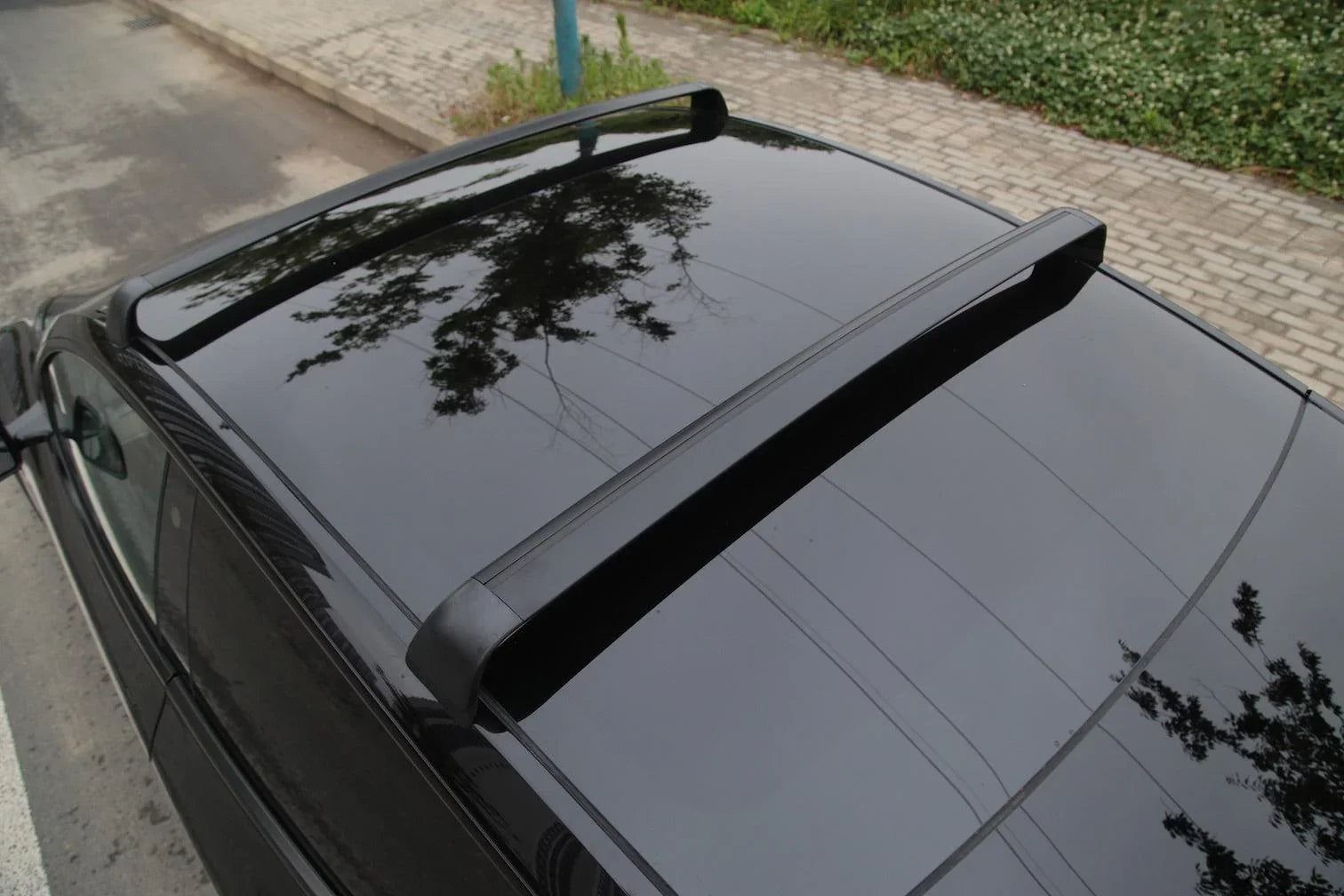 Top view of the roof rack cross bars installed on Model Y
