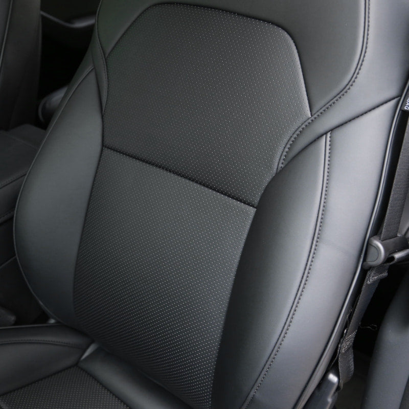 Close-up of the black perforated microfibre leather seat cover for Model Y