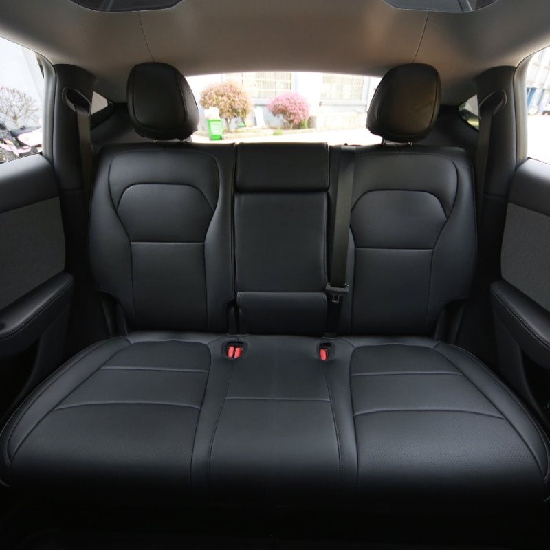 Black microfibre leather seat covers fitted across the Model Y rear cabin