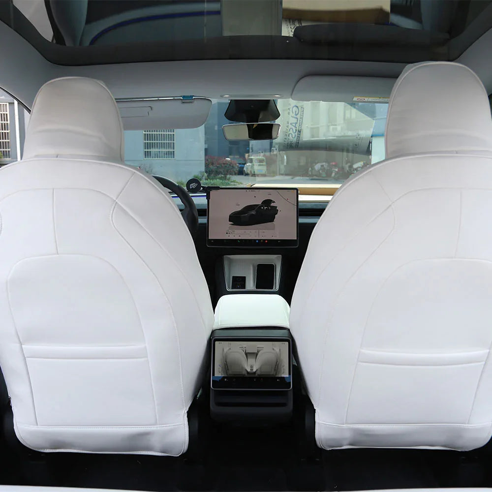 White microfibre leather seat covers fitted across the Model Y front cabin