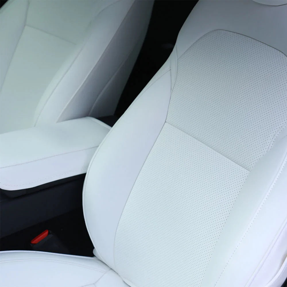 Close-up of the white microfibre leather front seat cover for Model Y