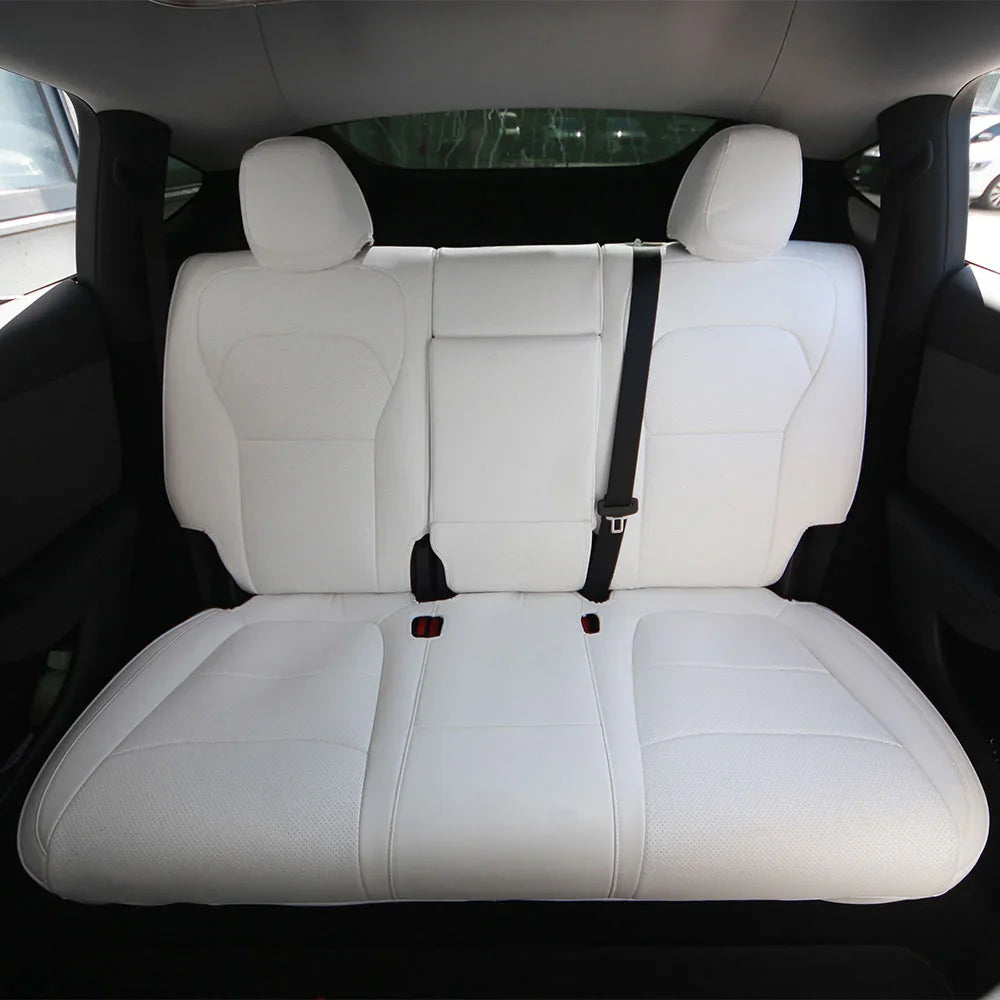 White microfibre leather rear seat covers installed in Model Y (2025–2026)