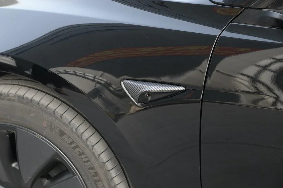 Close-up of the carbon fibre side indicator camera cap fitted to the side camera housing