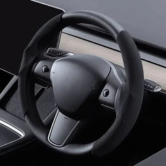 Steering wheel grip grab cover fitted to the steering wheel of Model Y and Model 3