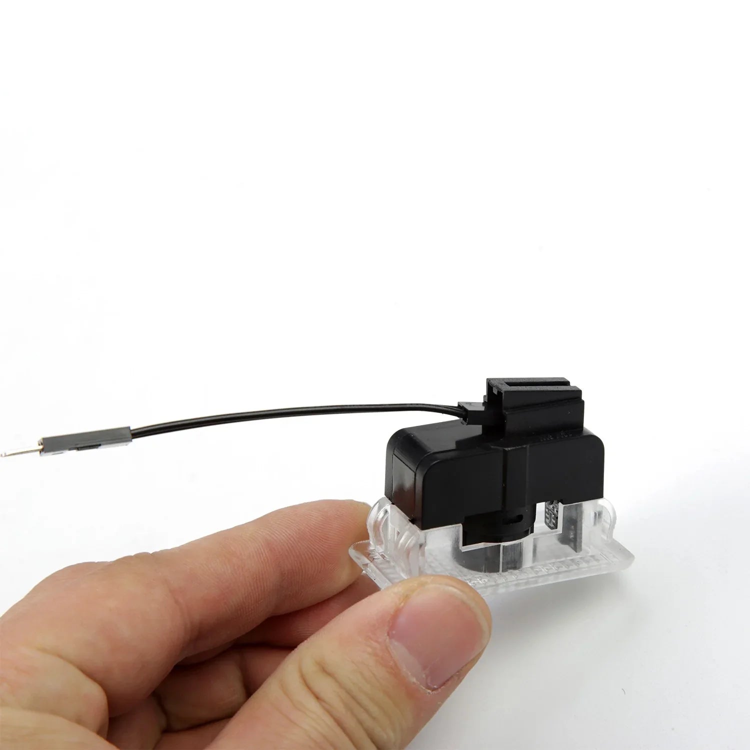 Plug-and-play Tesla puddle light with OEM-style connector