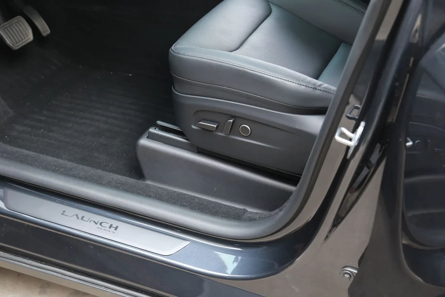 Front under seat carpet protector installed in Model Y