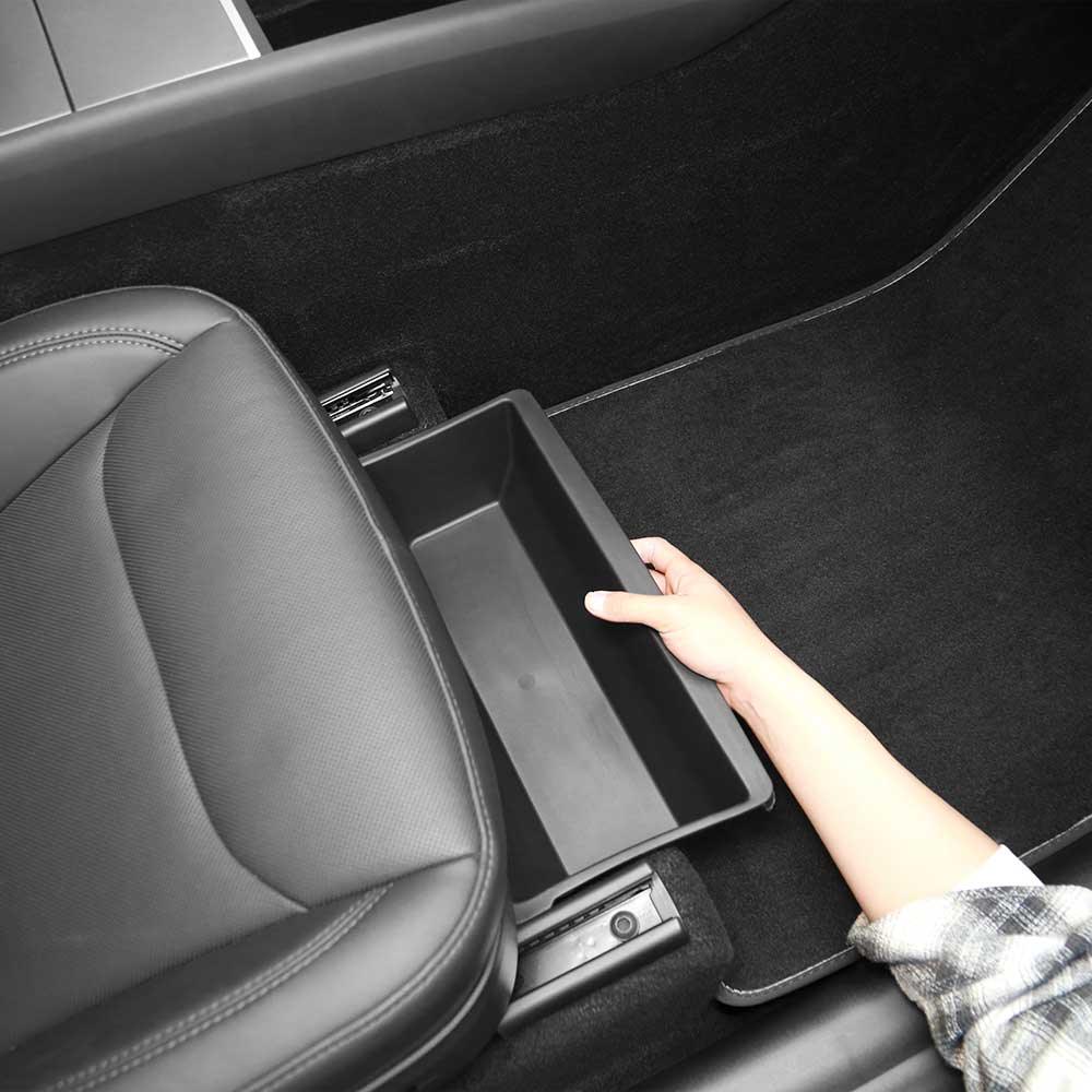 Slide-out under seat storage drawer for easy access to personal items in Model Y L