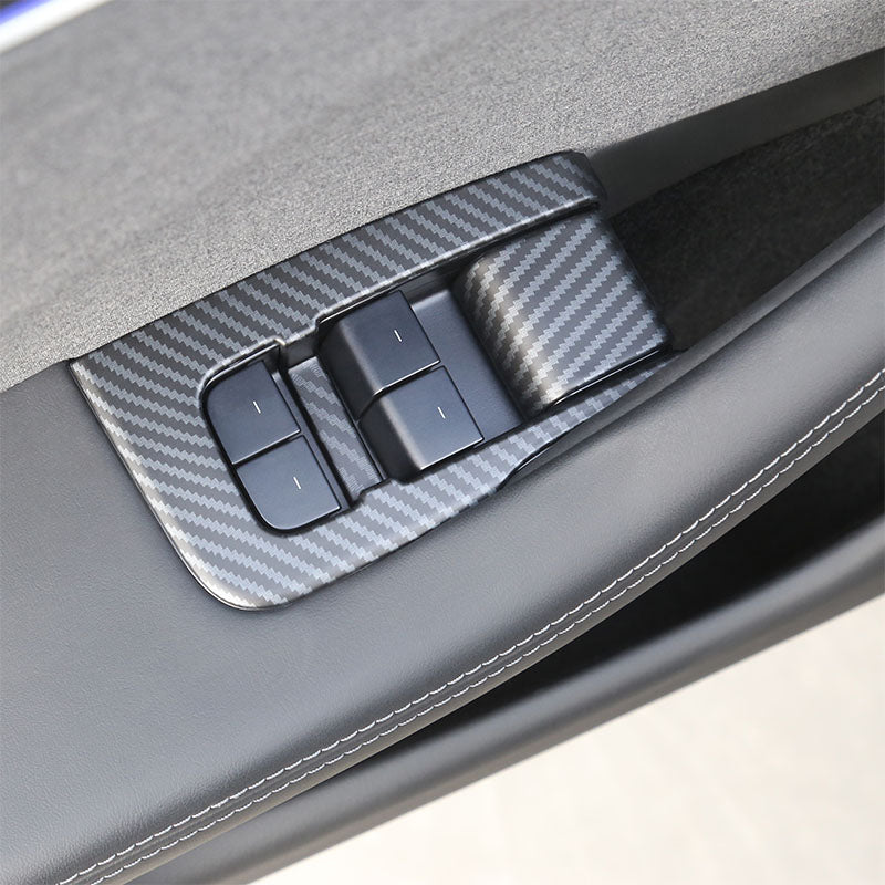 Close-up of the  ABS window lift switch button cover on Model 3