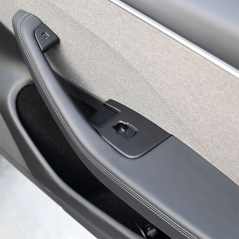 Matt Black window lift switch button cover installed on the front door of Model 3