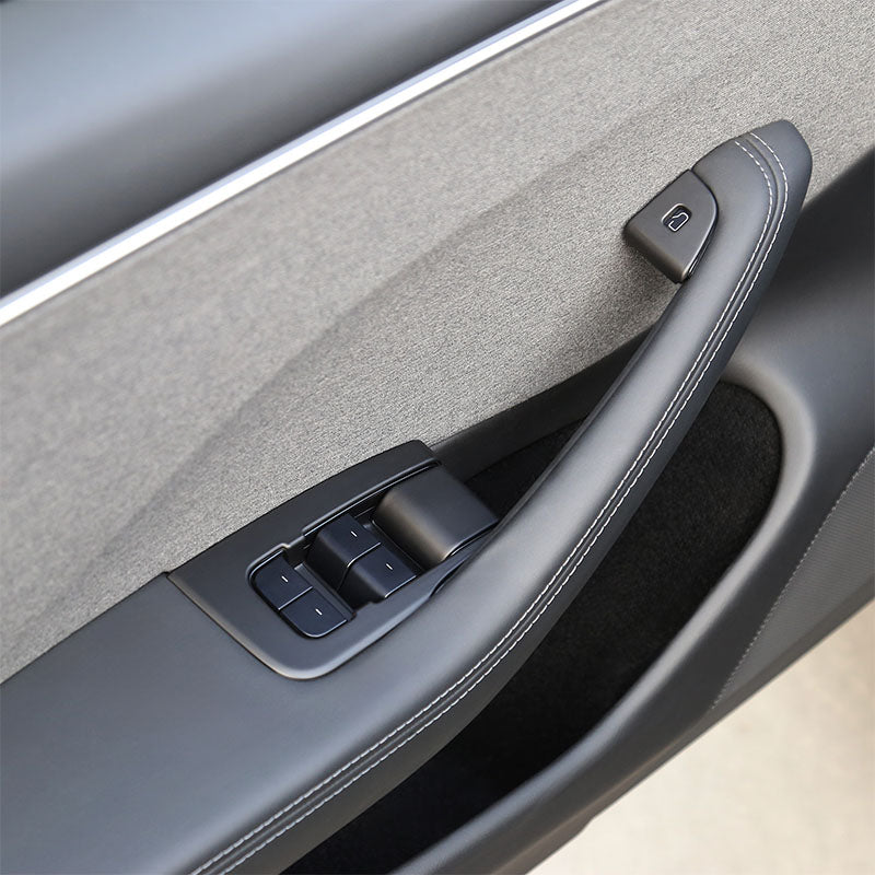 Matt Black window lift switch button cover installed on the rear door of Model 3