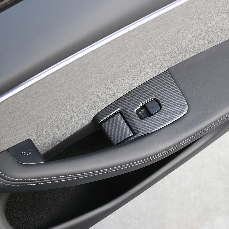 Matt Carbon Fibre window lift switch button covers fitted around the driver's window controls