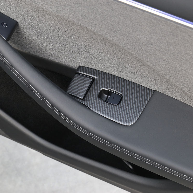 Matt Carbon Fibre window lift switch button cover installed on the rear door of Model 3
