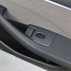 Matt Carbon Fibre window lift switch button cover installed on the rear door of Model 3