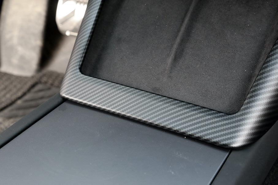 Close-up of the carbon fibre wireless phone charger surround installed around the charging area