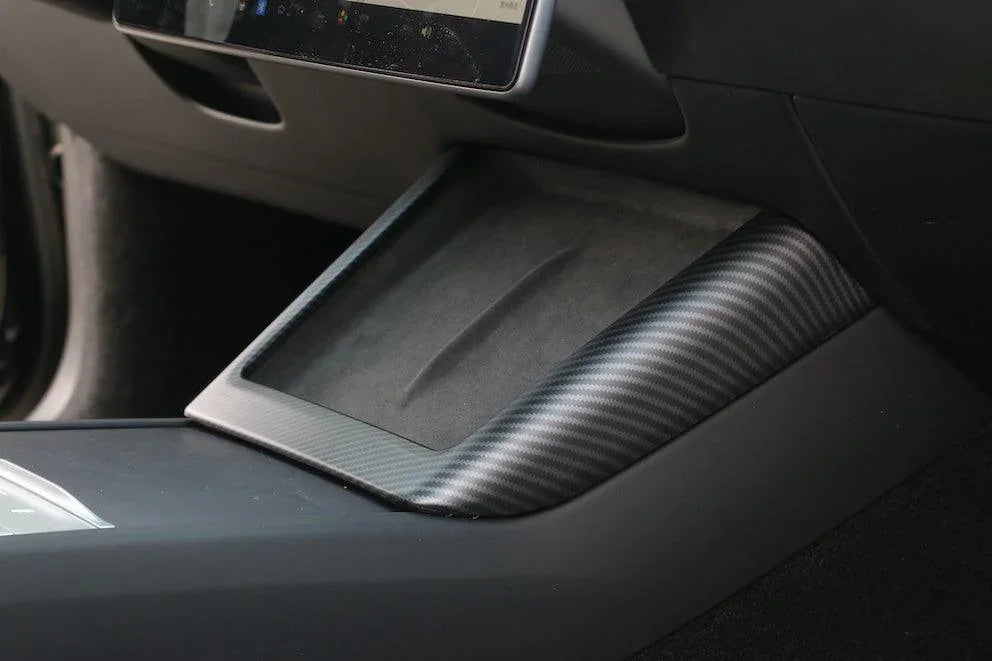 Carbon fibre wireless phone charger surround installed on Model 3 (2024–2026) and Model Y (2025–2026)