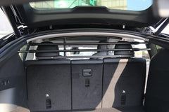 Cargo and pet barrier separating the cargo area from the passenger cabin
