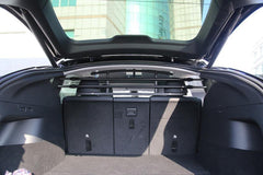 Cargo and pet barrier installed behind the rear seats of Model Y