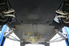 Coolant hose guard plate installed to protect the underside of the Model Y